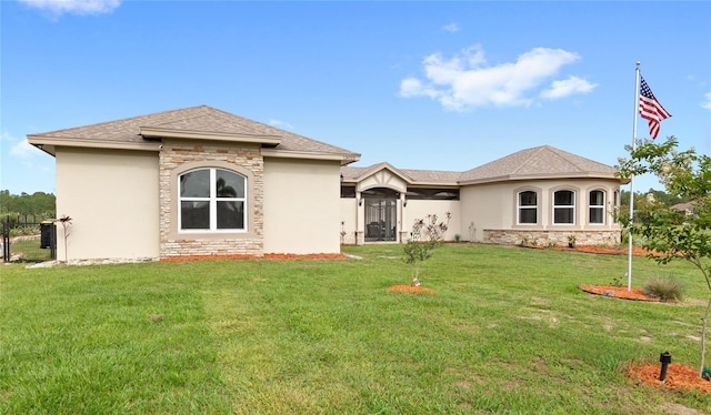 13023 Sweet Hill Rd, Polk City, FL 33868 - back of property featuring stone siding, a lawn, and stucco siding