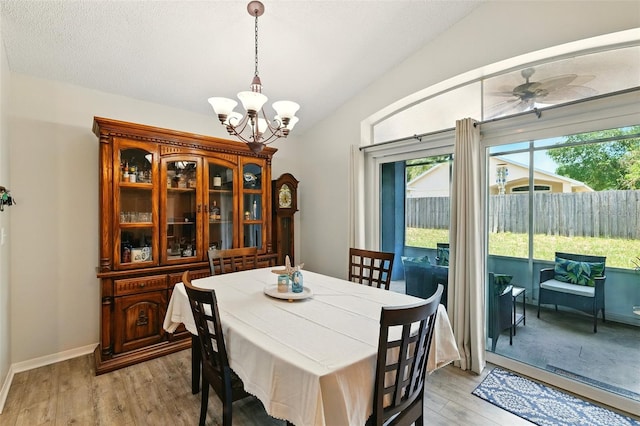 171 Cedarpark Ln, Davenport, FL 33837 - dining room with a chandelier, light wood-style flooring, and ceiling fan