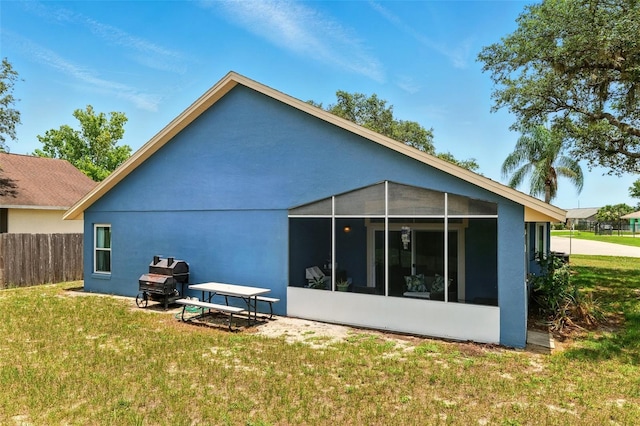 171 Cedarpark Ln, Davenport, FL 33837 - rear view of property with a sunroom and stucco siding