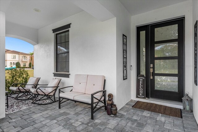 7454 Gathering Dr, Reunion, FL 34747 - doorway to property with stucco siding