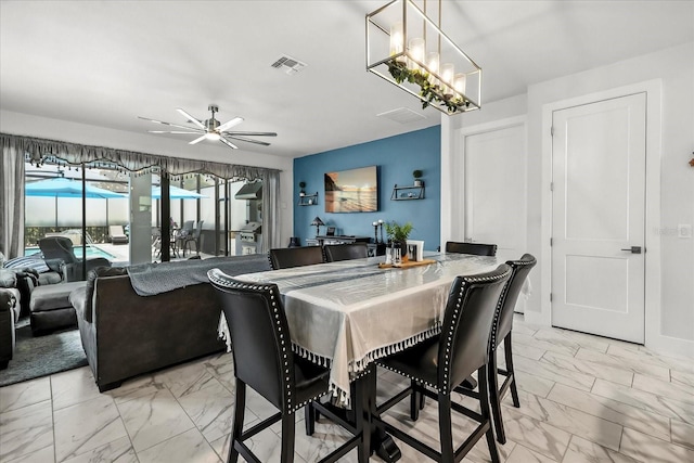 7454 Gathering Dr, Reunion, FL 34747 - dining space with light marble finish flooring and a ceiling fan