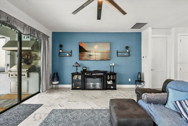 7454 Gathering Dr, Reunion, FL 34747 - living room featuring marble look tile flooring and ceiling fan