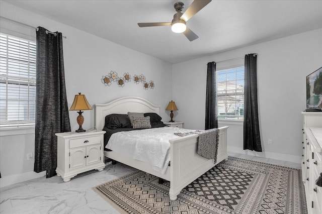 7454 Gathering Dr, Reunion, FL 34747 - bedroom with light marble finish floors and a ceiling fan