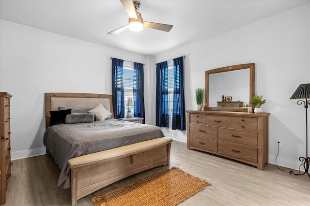 7454 Gathering Dr, Reunion, FL 34747 - bedroom featuring light wood-type flooring and a ceiling fan
