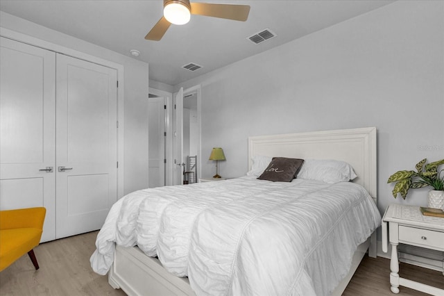 7454 Gathering Dr, Reunion, FL 34747 - bedroom featuring wood finished floors, a closet, and a ceiling fan