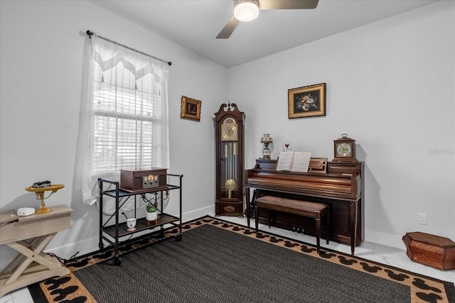 7454 Gathering Dr, Reunion, FL 34747 - living area featuring a ceiling fan and baseboards