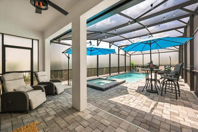 7454 Gathering Dr, Reunion, FL 34747 - view of pool featuring a pool with connected hot tub, ceiling fan, a patio, and glass enclosure