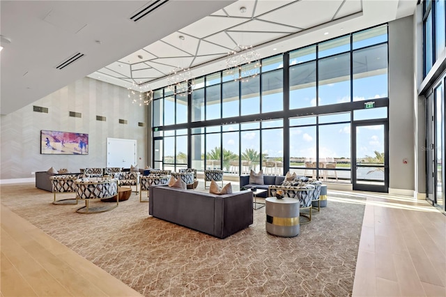 11687 SW Viridian Blvd, Port St Lucie, FL 34987 - lobby with a high ceiling, wallpapered walls, and expansive windows