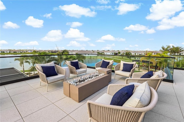 11687 SW Viridian Blvd, Port St Lucie, FL 34987 - view of patio / terrace featuring an outdoor living space with a fire pit, a residential view, and a water view