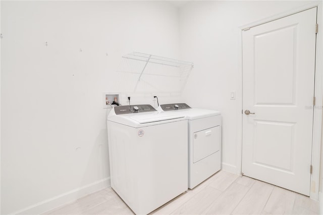 11687 SW Viridian Blvd, Port St Lucie, FL 34987 - laundry area with washer and dryer and baseboards