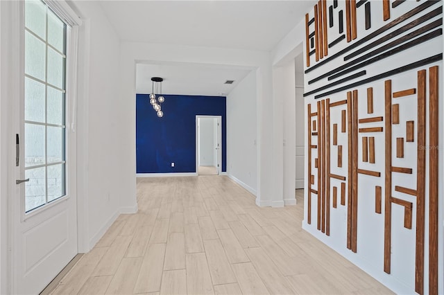 11687 SW Viridian Blvd, Port St Lucie, FL 34987 - hall featuring plenty of natural light and light wood-type flooring