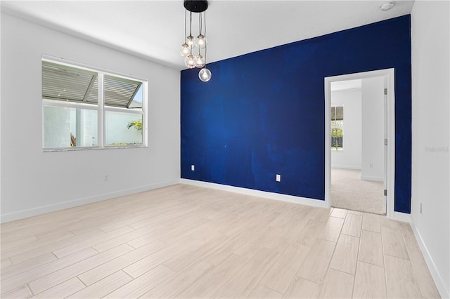 11687 SW Viridian Blvd, Port St Lucie, FL 34987 - empty room featuring wood finished floors and a smoke detector