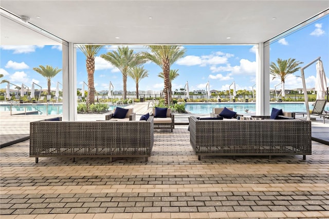 11687 SW Viridian Blvd, Port St Lucie, FL 34987 - view of patio featuring an outdoor living space and a community pool