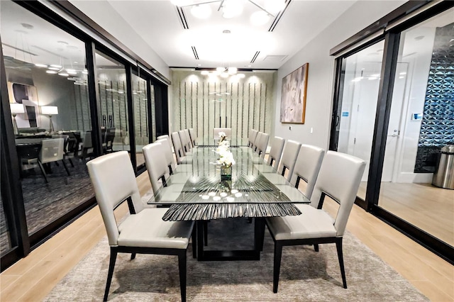 11687 SW Viridian Blvd, Port St Lucie, FL 34987 - dining room featuring a chandelier and wood finished floors