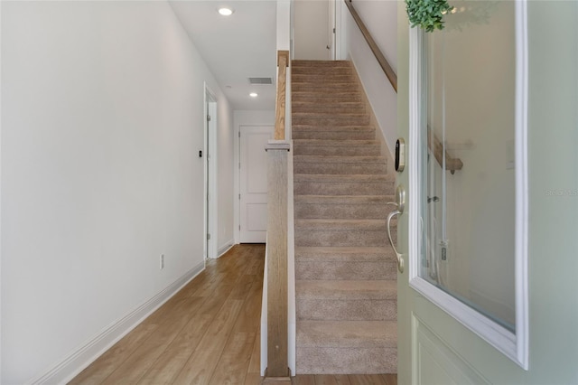 8484 Sperry St, Orlando, FL 32827 - stairway featuring recessed lighting and wood finished floors