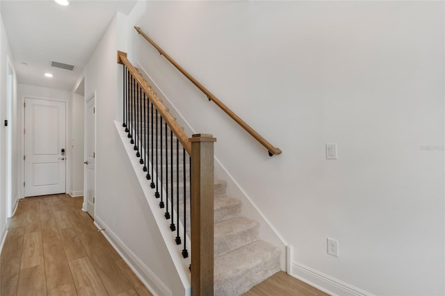 8484 Sperry St, Orlando, FL 32827 - staircase featuring wood finished floors and recessed lighting