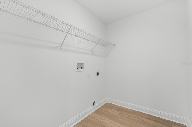 8484 Sperry St, Orlando, FL 32827 - washroom featuring electric dryer hookup, washer hookup, and light wood-type flooring