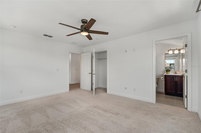 8484 Sperry St, Orlando, FL 32827 - unfurnished bedroom with light carpet, connected bathroom, a closet, and ceiling fan