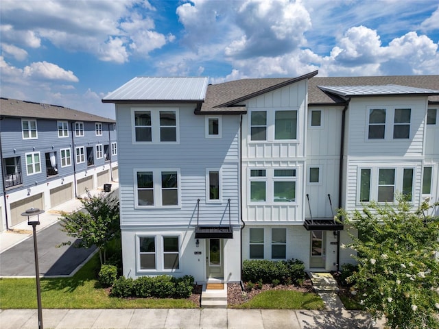 8484 Sperry St, Orlando, FL 32827 - multi unit property featuring board and batten siding and a shingled roof