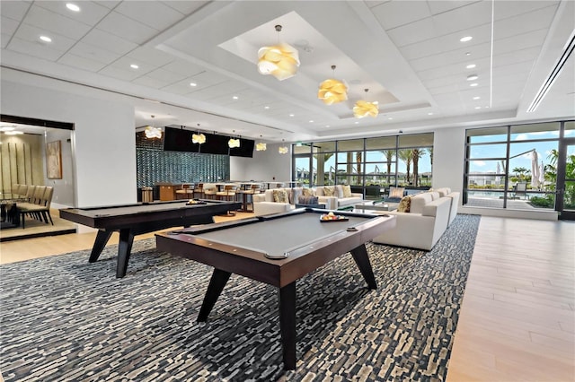 11695 SW Viridian Blvd, Port St Lucie, FL 34987 - game room featuring billiards, a tray ceiling, wood finished floors, and recessed lighting