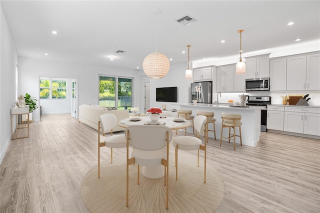 11695 SW Viridian Blvd, Port St Lucie, FL 34987 - dining room with recessed lighting and light wood finished floors