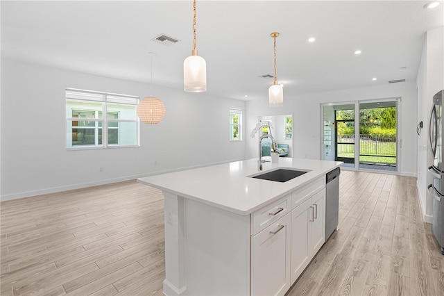 11695 SW Viridian Blvd, Port St Lucie, FL 34987 - kitchen featuring open floor plan, stainless steel appliances, light wood finished floors, and recessed lighting