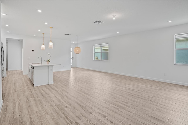 11695 SW Viridian Blvd, Port St Lucie, FL 34987 - unfurnished living room with light wood finished floors and recessed lighting