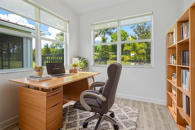 11695 SW Viridian Blvd, Port St Lucie, FL 34987 - office area with light wood-style flooring and baseboards