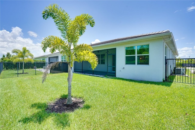 11695 SW Viridian Blvd, Port St Lucie, FL 34987 - back of property with stucco siding and a sunroom