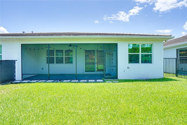 11695 SW Viridian Blvd, Port St Lucie, FL 34987 - rear view of property featuring stucco siding and a sunroom