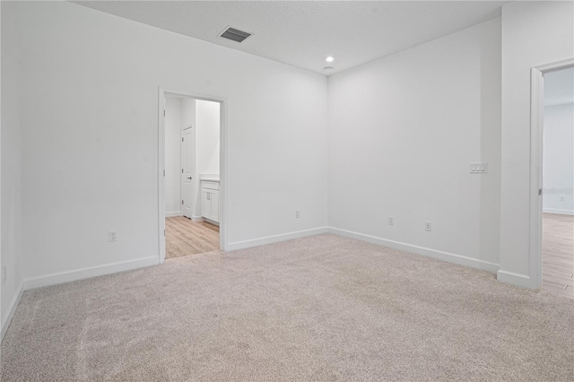 11695 SW Viridian Blvd, Port St Lucie, FL 34987 - spare room featuring light carpet and recessed lighting