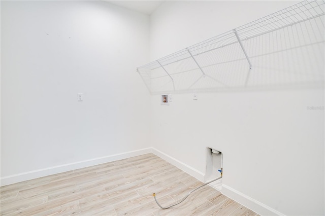 11695 SW Viridian Blvd, Port St Lucie, FL 34987 - laundry room with washer hookup, light wood-style flooring, and gas dryer hookup