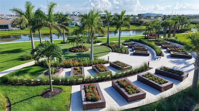11695 SW Viridian Blvd, Port St Lucie, FL 34987 - surrounding community featuring a water view, a yard, a garden, and a residential view