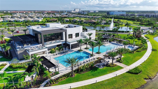 11695 SW Viridian Blvd, Port St Lucie, FL 34987 - drone / aerial view of a pool area and a large body of water