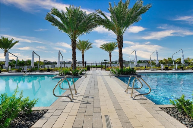 11695 SW Viridian Blvd, Port St Lucie, FL 34987 - community pool with a patio area