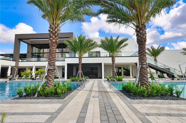 11695 SW Viridian Blvd, Port St Lucie, FL 34987 - view of building exterior with stairs and a community pool