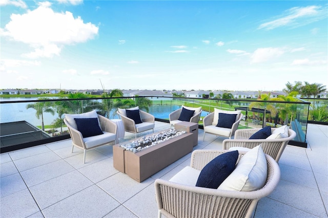 11695 SW Viridian Blvd, Port St Lucie, FL 34987 - view of patio featuring an outdoor living space with a fire pit and a water view