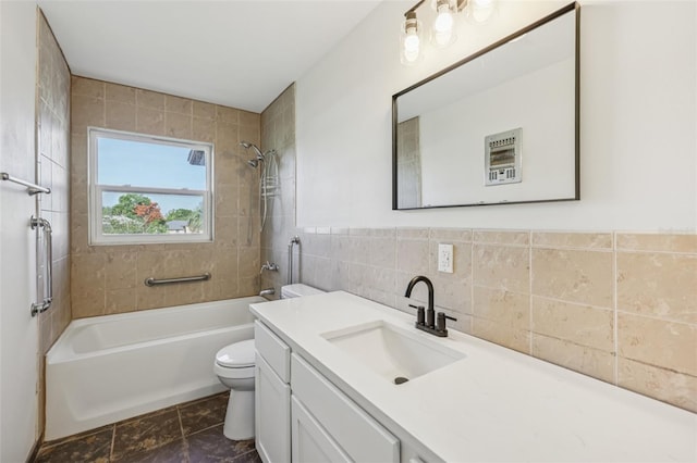 1320 E Lombardy Dr, Deltona, FL 32725 - bathroom featuring tile walls, bathing tub / shower combination, and vanity