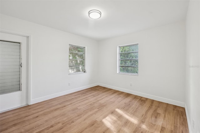 1320 E Lombardy Dr, Deltona, FL 32725 - unfurnished room with light wood-type flooring and baseboards
