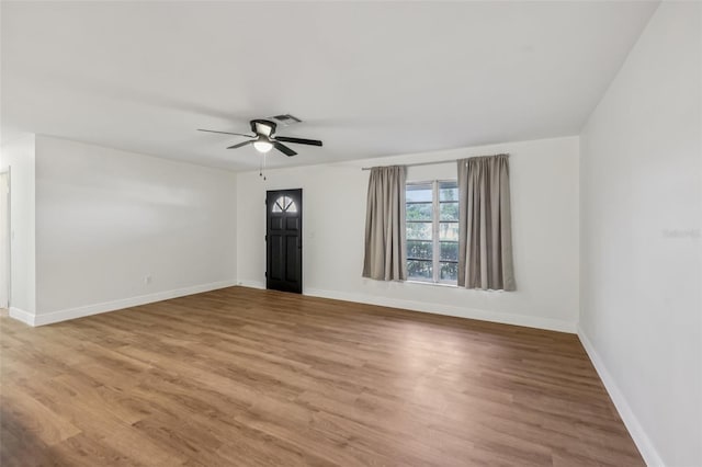 1320 E Lombardy Dr, Deltona, FL 32725 - unfurnished room featuring ceiling fan and wood finished floors
