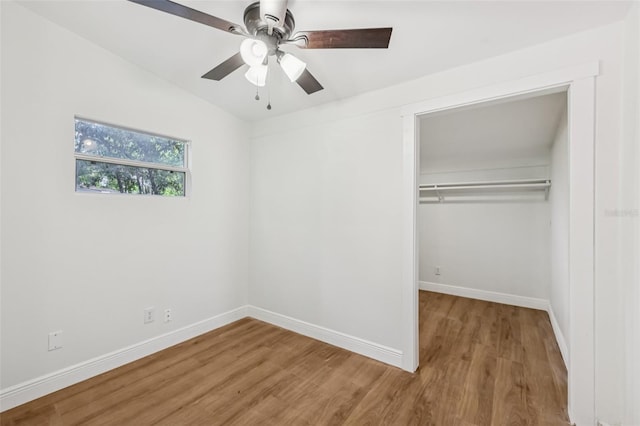 1320 E Lombardy Dr, Deltona, FL 32725 - unfurnished bedroom with wood finished floors, a closet, and a ceiling fan