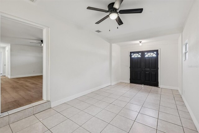 1320 E Lombardy Dr, Deltona, FL 32725 - foyer entrance featuring a ceiling fan and light tile patterned floors