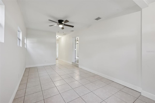 1320 E Lombardy Dr, Deltona, FL 32725 - empty room with light tile patterned floors and a ceiling fan