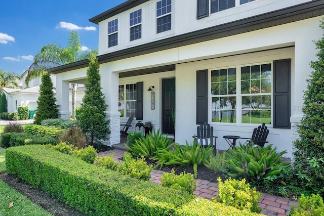 15787 Tangerine Dream Ct, Winter Garden, FL 34787 - entrance to property with covered porch and stucco siding