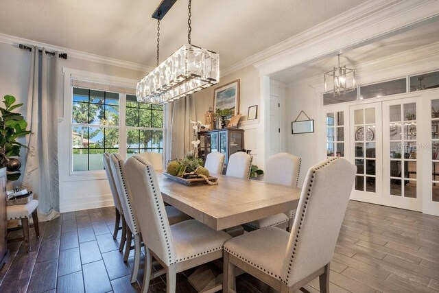 15787 Tangerine Dream Ct, Winter Garden, FL 34787 - dining room featuring a chandelier, crown molding, dark wood-style flooring, and french doors