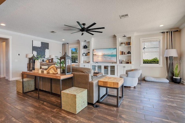 15787 Tangerine Dream Ct, Winter Garden, FL 34787 - living area featuring ornamental molding, dark wood-style floors, ceiling fan, a textured ceiling, and recessed lighting