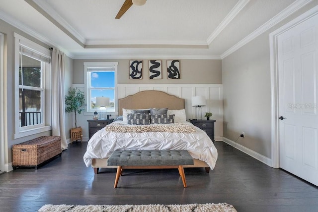 15787 Tangerine Dream Ct, Winter Garden, FL 34787 - bedroom featuring a tray ceiling, dark wood-type flooring, crown molding, and ceiling fan