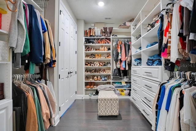 15787 Tangerine Dream Ct, Winter Garden, FL 34787 - walk in closet featuring dark wood-style flooring