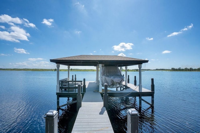 15787 Tangerine Dream Ct, Winter Garden, FL 34787 - dock featuring boat lift and a water view