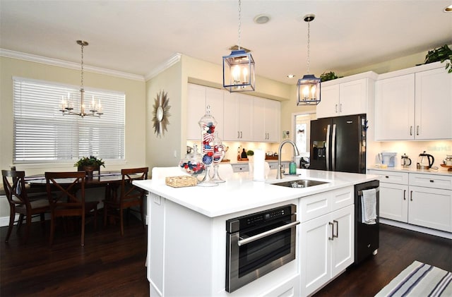 436 Skyview Pl, Chuluota, FL 32766 - kitchen featuring black appliances, a chandelier, light countertops, dark wood-style flooring, and crown molding